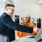 unknown person using laptop