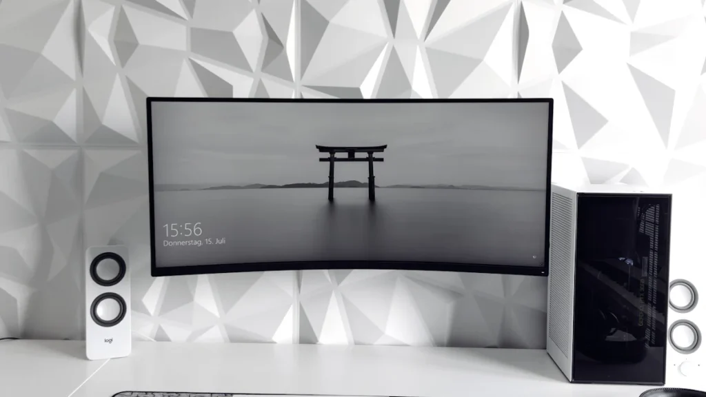 a computer monitor sitting on top of a desk