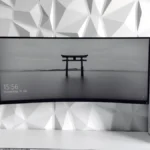 a computer monitor sitting on top of a desk