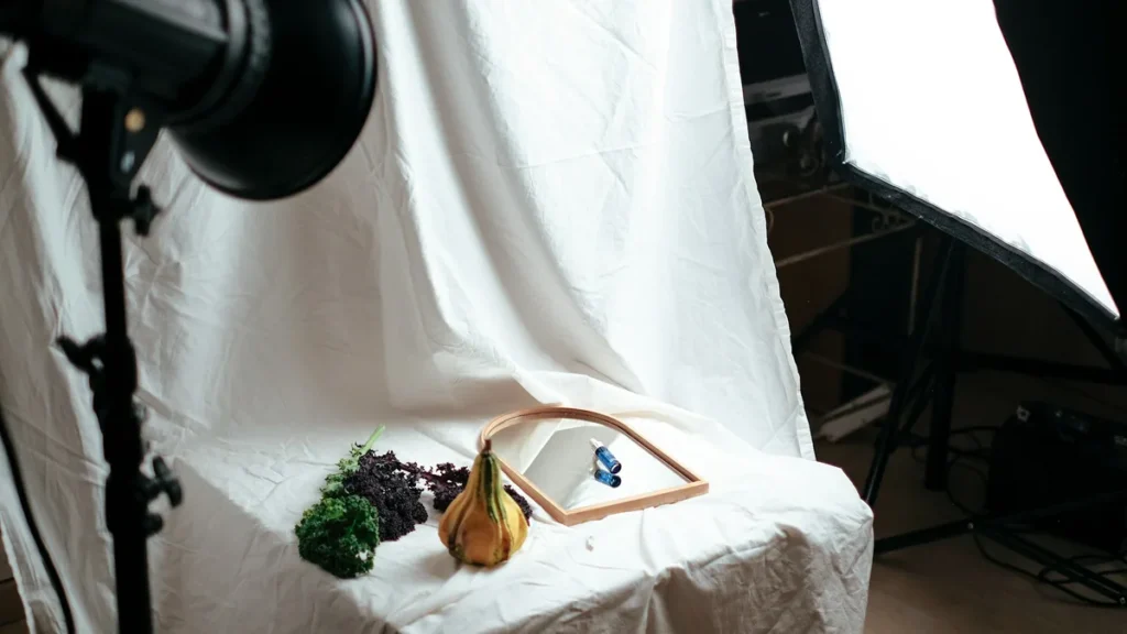 Product photography setup with studio lights and a white backdrop, for Shopify product page optimization