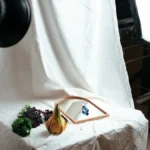 Product photography setup with studio lights and a white backdrop, for Shopify product page optimization