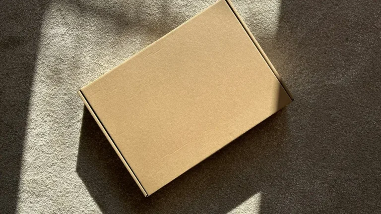 Cardboard shipping box in sunlight, illustrating Shopify shipping settings
