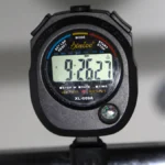 a close up of a stopwatch on a car