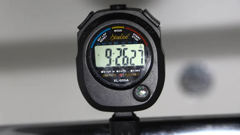 a close up of a stopwatch on a car