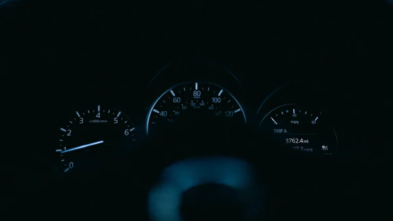 The dashboard of a car in the dark