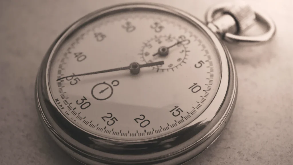 Silver pocket watch showing 10:00